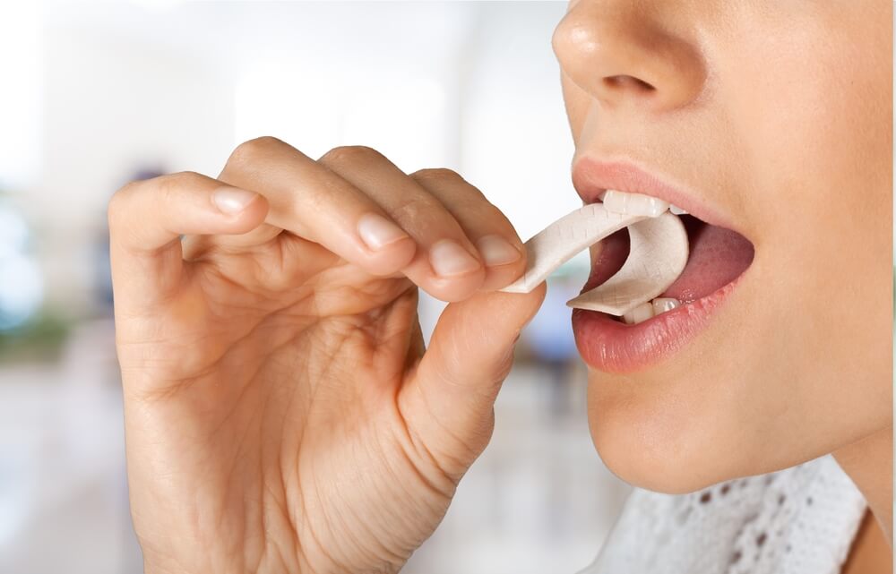 A woman with chewing gum.