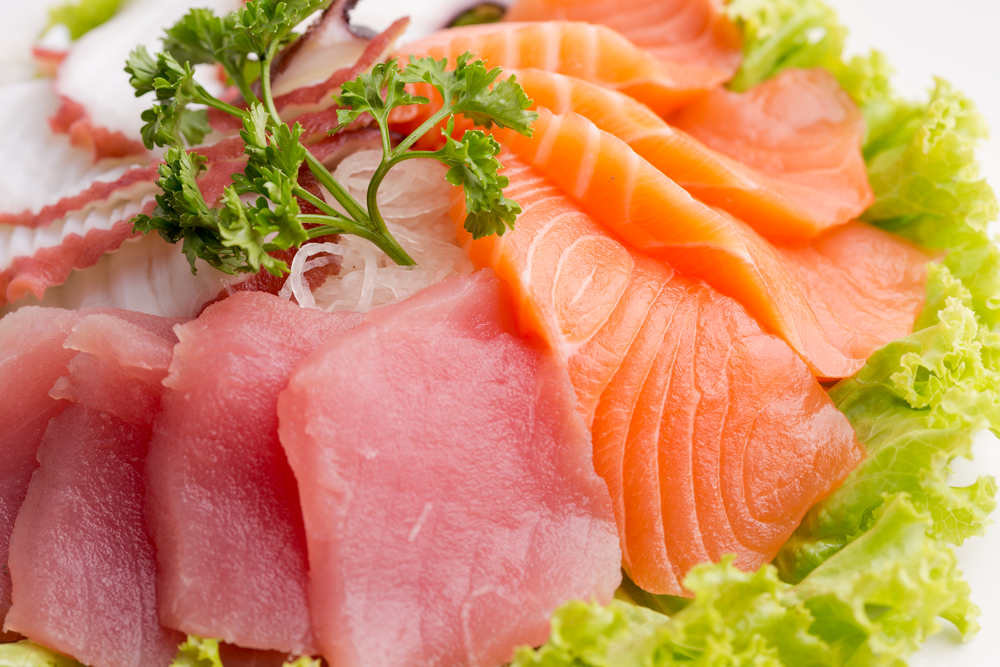 Thin slices of raw salmon and tuna rich in Omega 3 fatty acids.