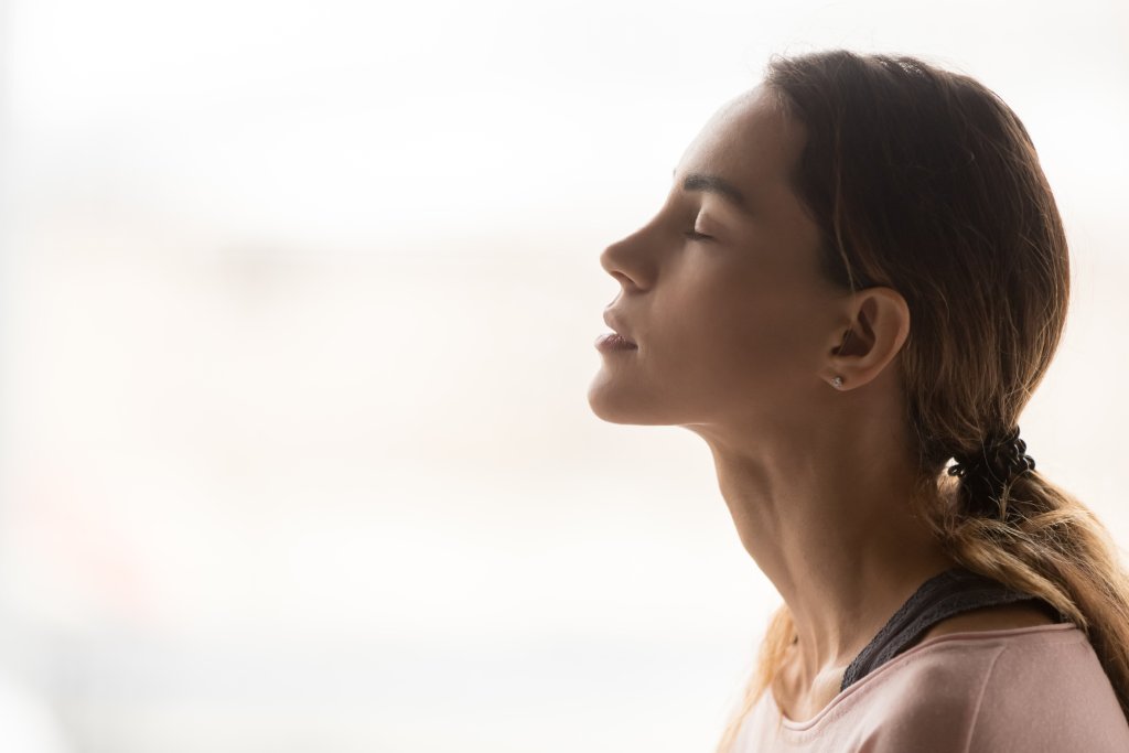 Serene,Young,Woman,Taking,Deep,Breath,Of,Fresh,Air,Relaxing