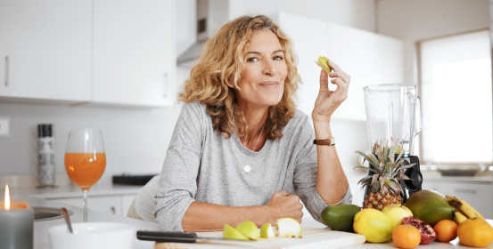 woman surrounded by fruit for a healthy meal, healthy lifestyle