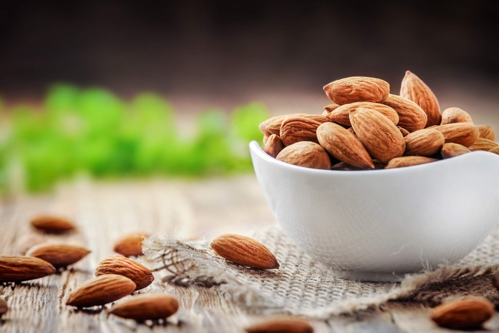 Almonds in a cup on the table.